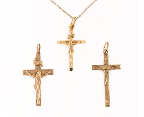 Two 9 ct gold crucifix, together with a necklace with cross.&nbsp; 6.3 grams.