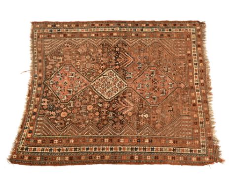 An antique Persian tribal rug, decorated with birds, horses and a figure. 188 x 162 cm (see illustration).