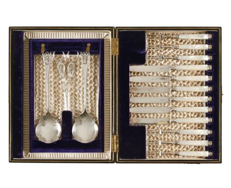 A cased set of dessert knives and forks, complete with servers.There are no makers marks to the cutlery.  Most items are clea