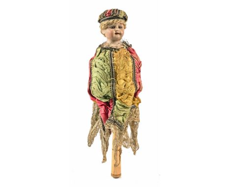 An antique German Marotte musical bisque headed doll, with open mouth and protruding teeth.  Overall height 34 cm.