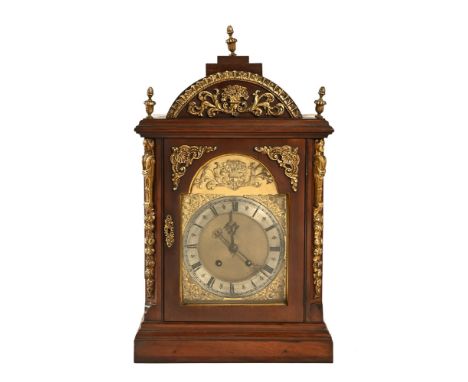 A bracket clock, with gilt decoration and silvered dial with Roman numerals, with twin fusee movement and comes with key and 
