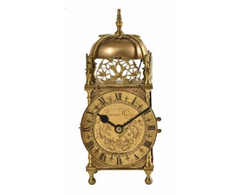 A brass lantern clock, the dial marked Thomas Mudge, timepiece only compete with key.  Height 25 cm.