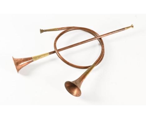Two vintage brass and copper hunting horns.  Longest 70 cm. 