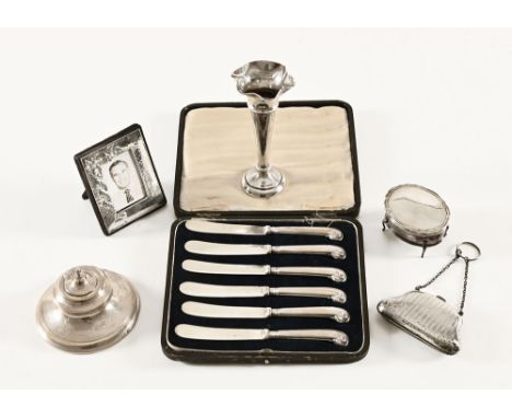 An antique silver purse, Birmingham 1908, picture frame, dressing table CWJ, specimen vase and case of silver mounted knives.