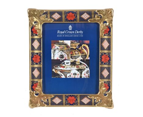 A Royal Crown Derby Old Imari pattern large photo frame, pattern 1128. 35 cm x 29 cm, printed marks in red.This is in excelle