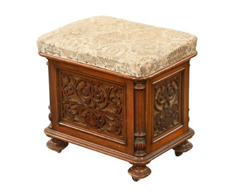 A Victorian walnut and fretwork music Canterbury and combined stool, with stuffover top and raised on short turned feet.  Hei