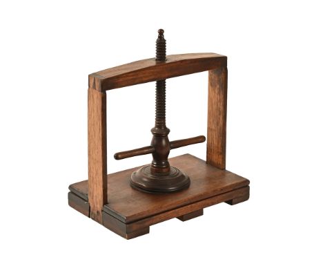 A Victorian and later book press, of small form.  Height 39 cm, width 34 cm, depth 21 cm.