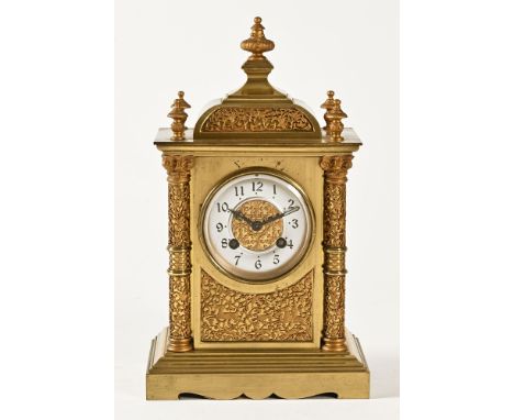 A 19th century French brass eight day mantel clock, with pillared step and finial top, silvered dial, winding holes at 4 and 