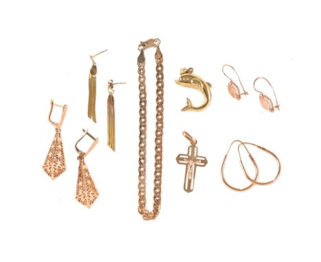 A miscellaneous collection of 14 ct gold jewellery, including charms, earrings, crucifix etc.&nbsp; Gross weight 21 grams.