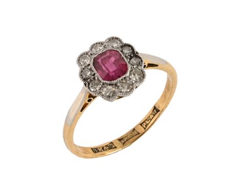 An 18 ct gold diamond and ruby ring Size N, weight 2.4 grams.The ruby is in good order and we cannot see any signs of any inc