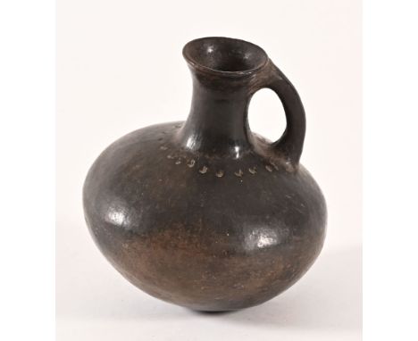 An antique oriental wine ewer, with Bluette &amp; Sons London label to base.  Height 19 cm.