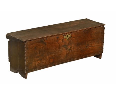 A late 18th/early 19th century oak plank coffer, with border decoration and brass lock escutcheon.  Height 38 cm, width 103 c