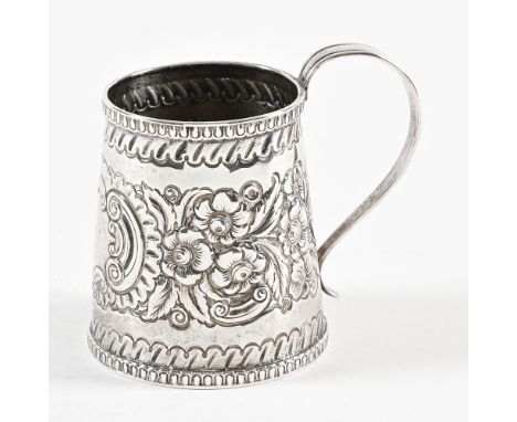 An Irish Dublin silver christening mug 1825, repousse with foliage and scroll work.  Height excluding handle 7.5 cm.
