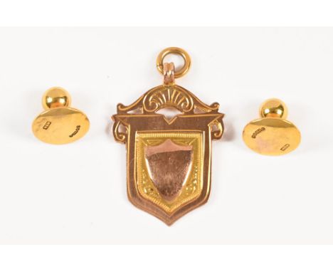 A 9 ct gold fob and two 9 ct gold shirt studs. Weight 5.3 grams. 