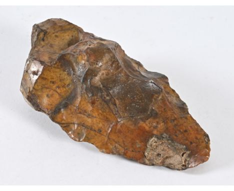 A large Paleolithic or Neolithic flint axe head, reputedly Lake District.  Length 18 cm.