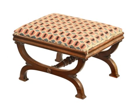 A Victorian mahogany stool, with cross frame and carved stretcher, upholstered in a pink and blue checked material.  Height 4