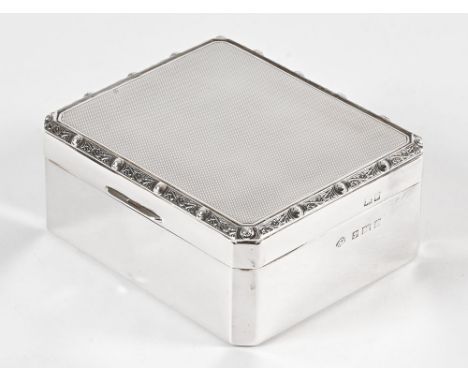 A silver lidded CWJ, with engine turned top and decorated edge, lined with wood and hallmark to the side Adie Brothers Birmin