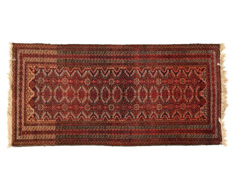 A vintage rectangular runner, with repeating border and geometric central pattern.&nbsp; 172 x 85 cm.