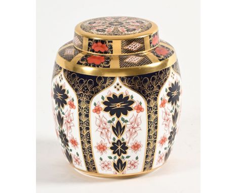 A Royal Crown Derby Imari pattern 1128 lidded ginger jar, with decorated gilt edging of floral patterns. Height 19 cm, with p