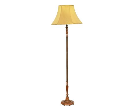 A late 20th century metal lamp standard, with yellow shade.  Height to light fitting 149 cm.