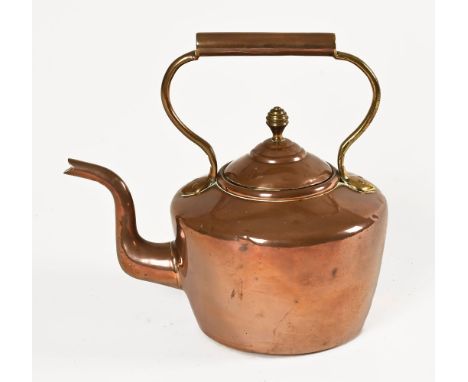 A Victorian copper and brass mounted kettle.  Height 32 cm. 