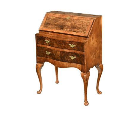 A walnut Queen Anne style bureau, with well figured slope opening to a fitted interior with two serpentine drawers beneath ra