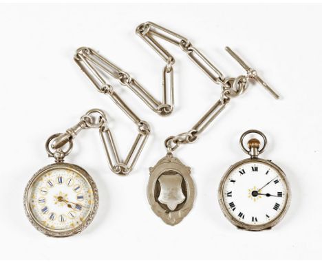 A late Victorian foliate engraved silver fob watch, with silver chain, T bar and fob and another knob wind pocket watch.