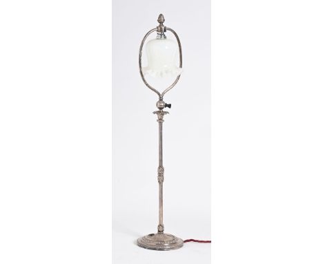 An antique silver plate tall electric lamp, in the style of Farraday &amp; Son, with open glass shade.  Height 73 cm.