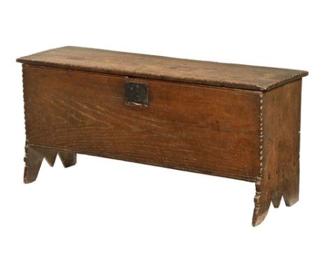 A late 18th century plank coffer, with steel lock raised on bracket feet.  Height 59 cm, width 126 cm, depth 38 cm.