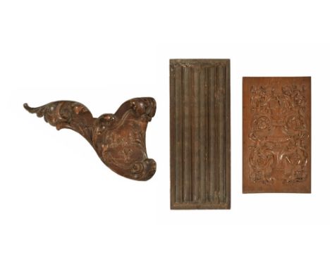 Three late 19th century oak panels, of various forms, the smallest rectangular with urn and winged cherubs.  Height 47 cm, wi