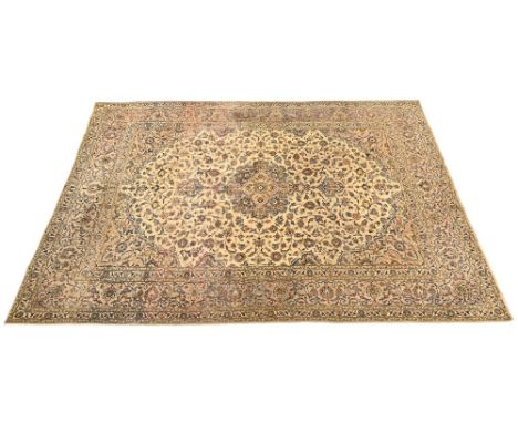 A Persian Kashan style rug, with cream ground and floral design.  406 x 290 cm.