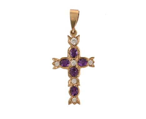 A 9 ct gold crucifix, set with amethysts.  4 cm long, weight 4.1 grams.