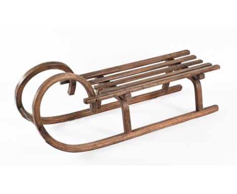 A late 19th/early 20th century vintage child's sledge, with upturned curved front. Length 101 cm (see illustration).
