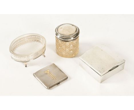 An Art Deco silver compact, a silver table cigarette CWJ, a silver mounted oval glass bowl and dressing table jar.