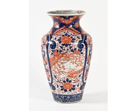 A large Imari vase, with panels decorated with vases blossom and birds. Height 45 cm.The vase is generally in good order.  Ho