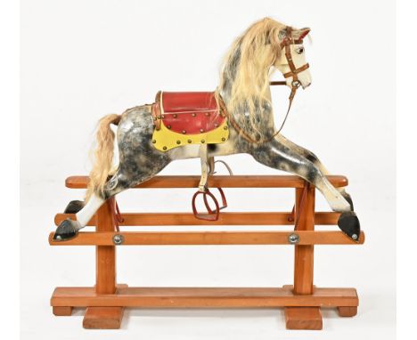 A Leeway painted wooden trestle rocking horse.  Height to top of ears 86 cm, trestle length 91 cm.
