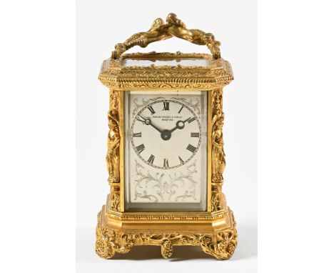 Manoah Rhodes &amp; Sons Ltd Bradford, an ornate gilt cased carriage clock with four glass sided case, the dial marked Manoah
