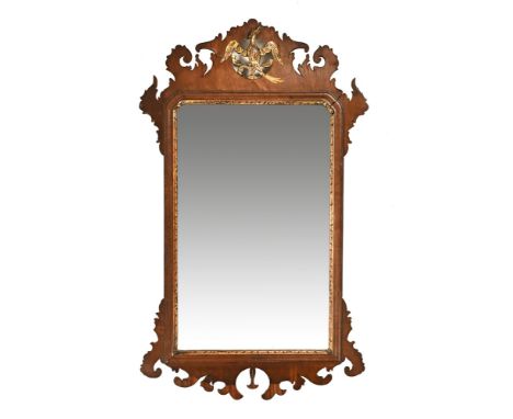 A large Georgian fretwork wall mirror, with gilt Ho Ho bird mount and gilt slip with re-entrant corners to the mirror frame. 