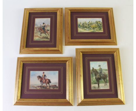 A set of four military pictures mounted in gold frames, each image postcard size.