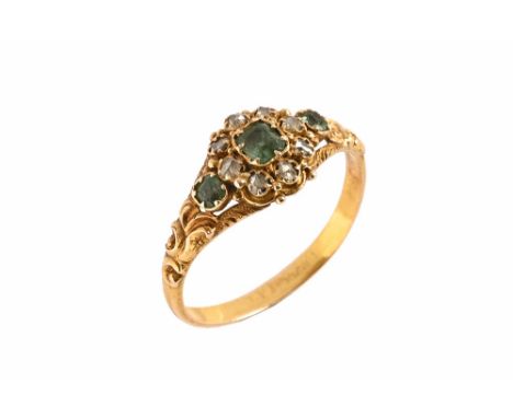 A 19th century emerald and diamond cluster ring, with gold coloured metal shank, with case. size O (see illustration).The rin