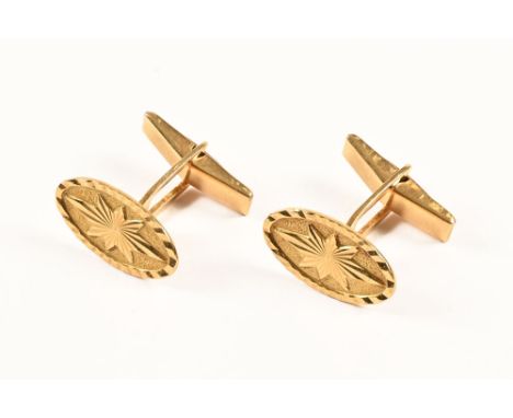 A pair of 18 ct gold engraved cufflinks.&nbsp; 10.3 grams. 