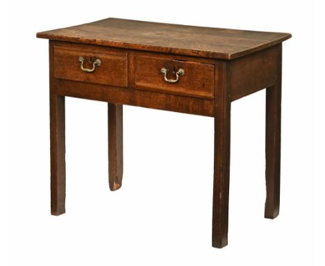 A 19th century oak side table, with rectangular top and two drawers with brass drop handles raised on legs of rectangular sec