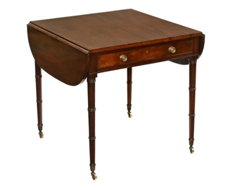 A Regency mahogany occasional table, with drop flap to either side and with single frieze drawer with brass drop handles and 