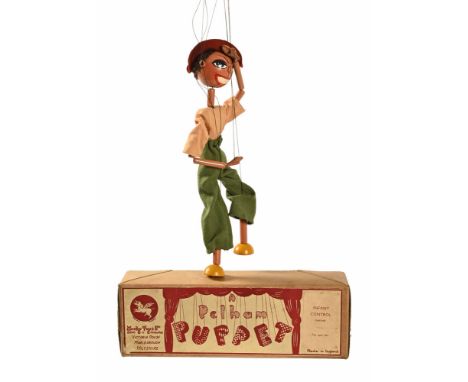 A vintage Pelham cowboy puppet, CWJed (see illustration).