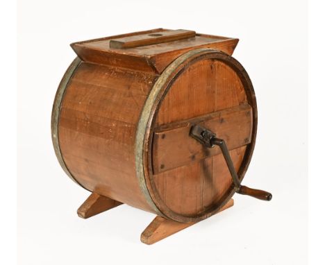 A vintage butter churn, metal bound and with side handle.  Diameter 43 cm.