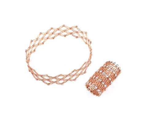 Pair of Italian 18 Karat Rose and White Gold Expandable Lattice Link Cuff Bangle Bracelets. Stamped Italy 18K. Measure 1" W. 