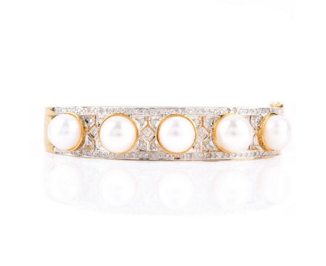 Micro Pave Set Diamond, Pearl and 14 Karat Yellow Gold Hinged Bangle Bracelet. Stamped 14K 585. Pearls measure 9mm. Measures 