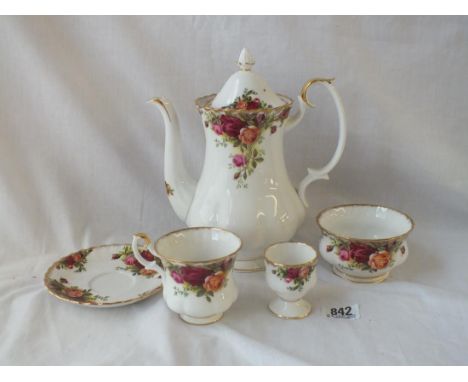 A matching coffee set of coffee pot and cover, 11 cups and 12 saucers and an egg cup.