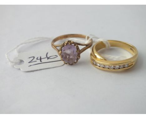 An amethyst ring &amp; crossover ring both in 9ct &amp; both size P - 7.8gms