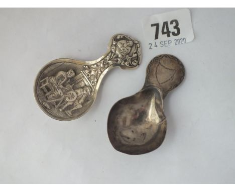 A George III bright cut caddy spoon, 1783, by WB, and a Dutch caddy spoon.